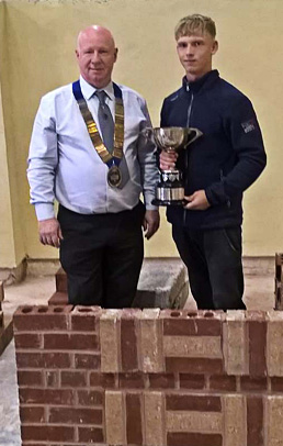 Guild of Bricklayers president, Kevin Harold, with junior section winner of the Notts/Lincoln heat, William Austin
