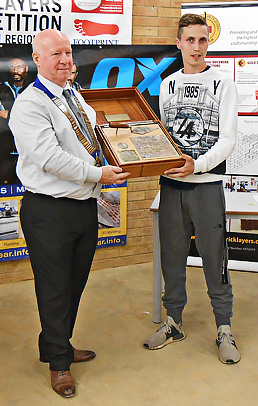 London senior heat winner, Joseph Ritchie, receives his award from Guild of Bricklayers president, Kevin Harold
