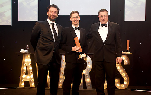 Presentation of the MIA sponsored Architect’s Choice award to architect’s Anderson Bell + Christie associate, Jonathan McQuillian, by chairman of the MIA executive committee, Steve Large (right), accompanied by presenter Nick Knowles