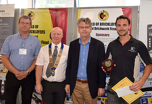 London senior heat winner, Joseph Ritchie, receives his award from Guild of Bricklayers president, Kevin Harold
